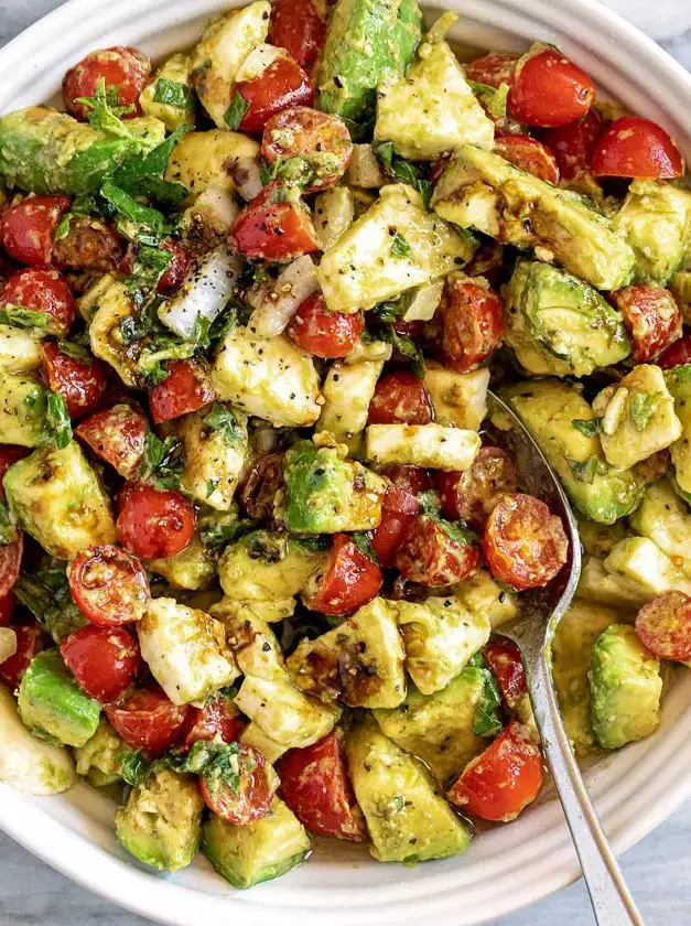 Caprese Avocado Salad with Mozzarella, Pesto, Tomato, and Balsamic